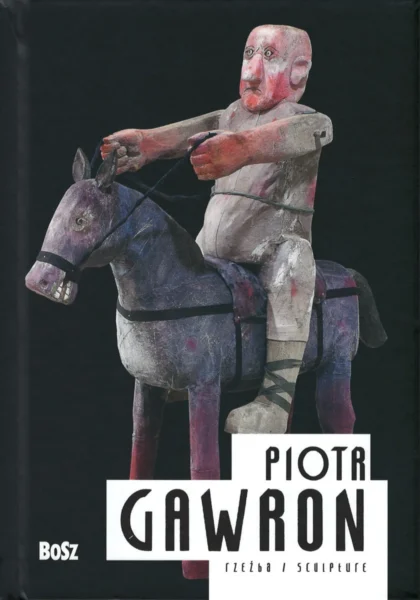 Na czarnej okładce widoczna jest rzeźba przedstawiająca jeźdźca na osiołku