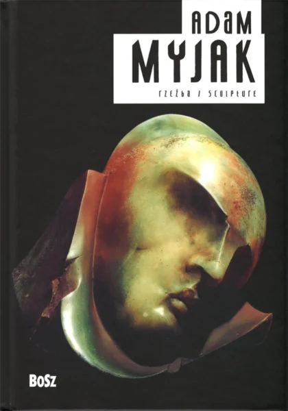 Na czarnej okładce znajduje się złota rzeźba przedstawiająca głowę