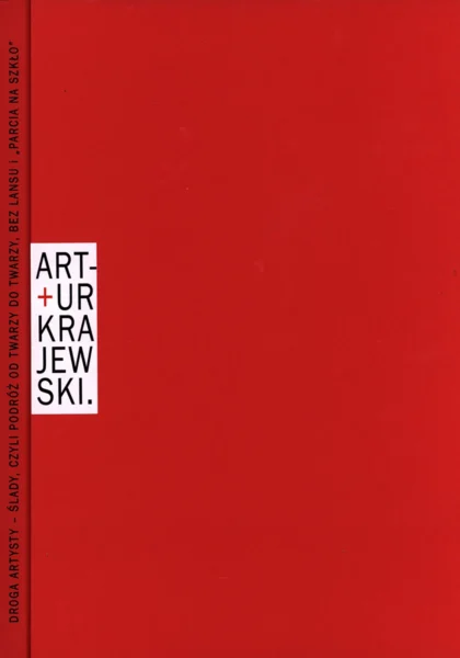 Czerwona okładka z imieniem i nazwiskiem autora publikacji umieszczonym po lewej stronie w białym pionowym prostokącie