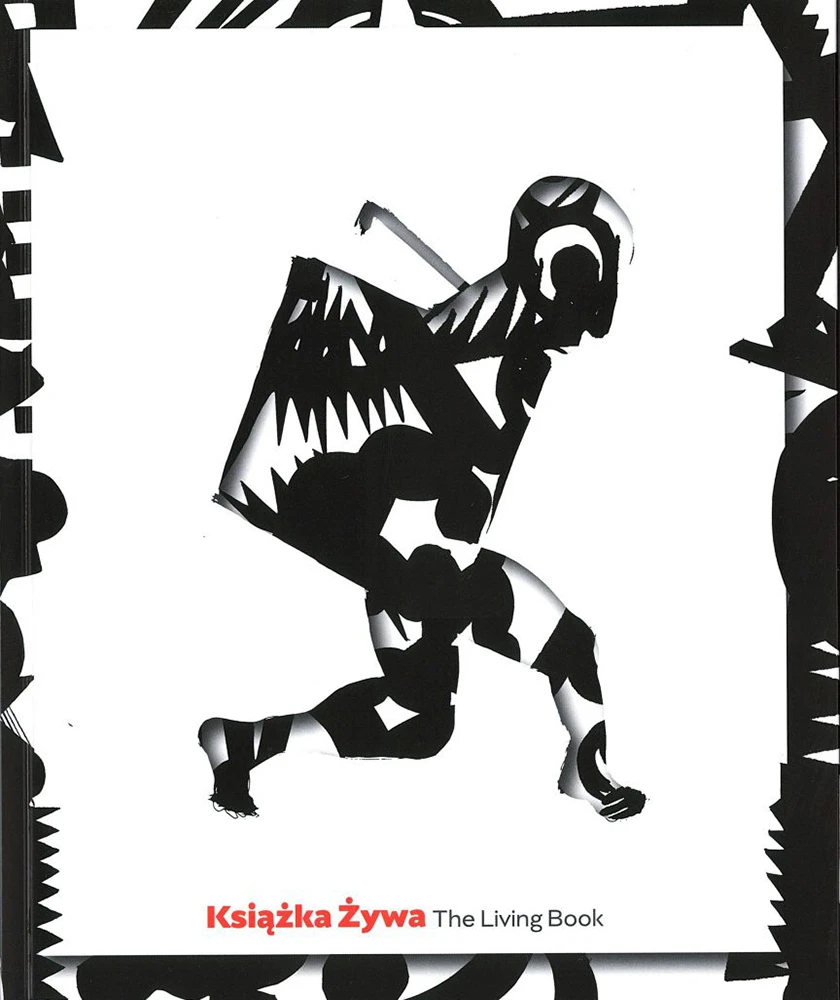 Na białym tle otoczonym dookoła czarno-białymi wzorami widnieje pośrodku wycięta sylwetka człowieka