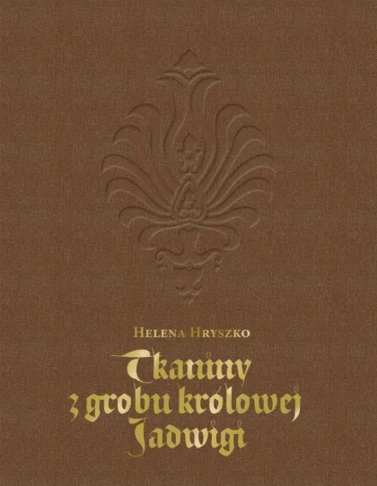 Na brązowej okładce widać emblemat oraz złoty tytuł publikacji