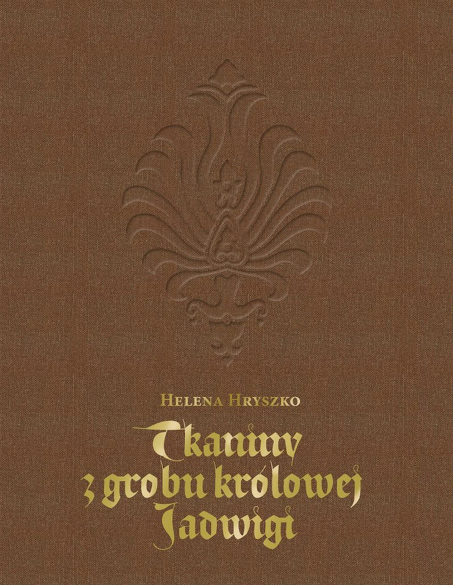 Na brązowej okładce widać emblemat oraz złoty tytuł publikacji
